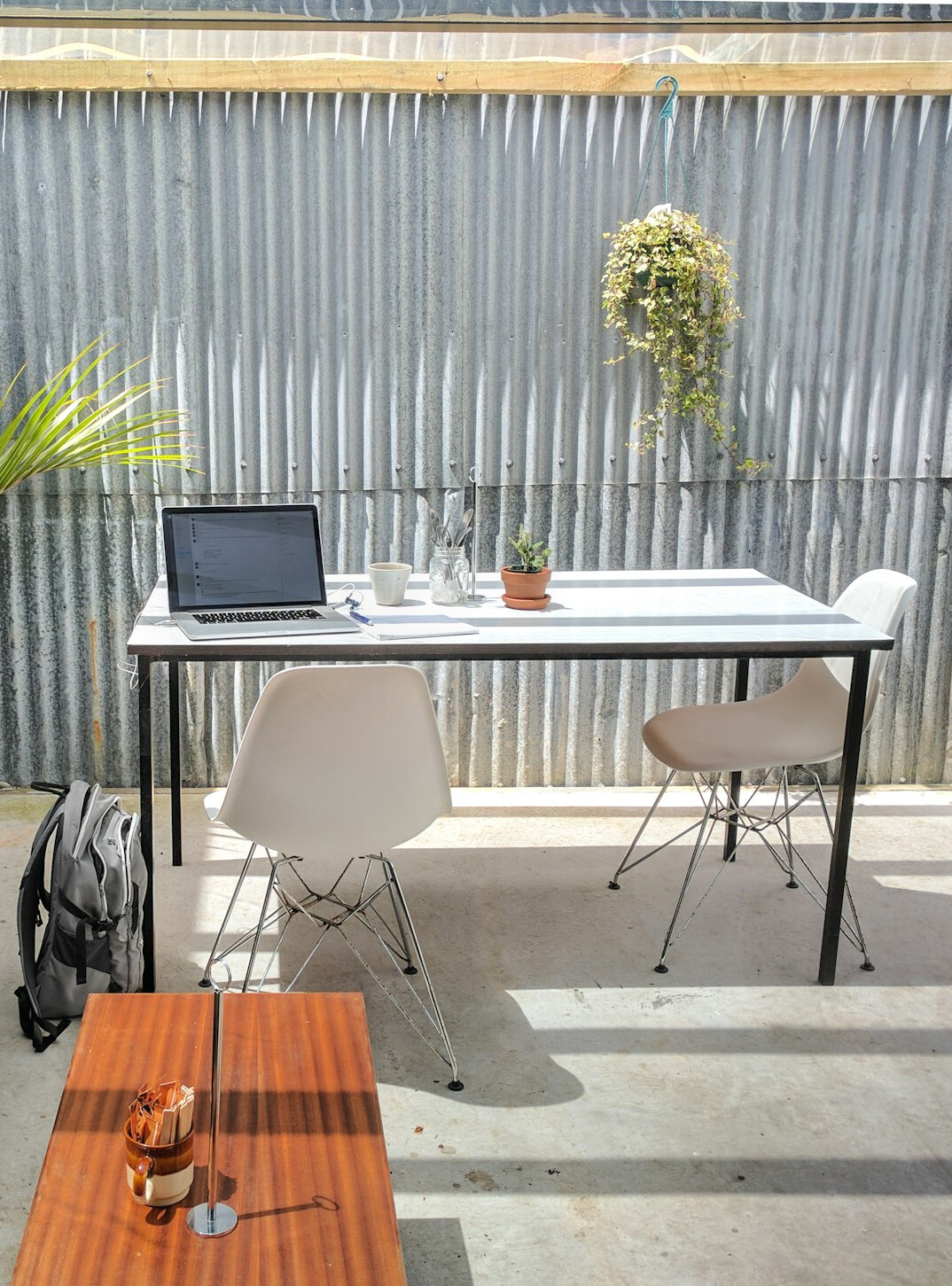 Desk with laptop showing charts and business documents