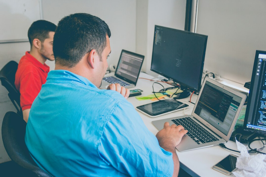software developers coding together